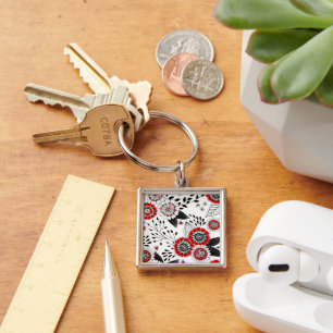 Llavero Flores y hojas de perro en rojo y negro