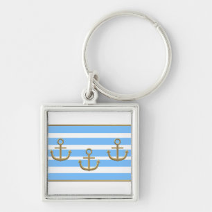 Llavero fondo blanco azul del ancla dorada