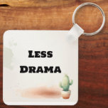 Llavero Funny Less Drama Quote Kawaii Cactus Art<br><div class="desc">Keep it simple and stress-free with this "Less Drama" kawaii cactus keychain! Featuring a tiny, smiling watercolor succulent and a bold, sarcastic quote, this minimalist design is perfect for those who love a touch of humor with their daily essentials. Its soft earthy tones and clean aesthetic make it a great...</div>