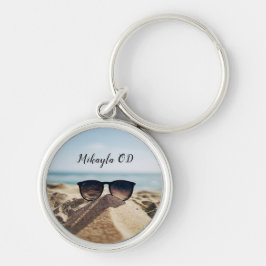 Llavero Gafas de oro de moda en una playa óptica    