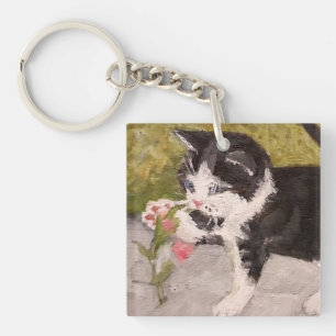 Llavero Gatito jugando con flor rosa