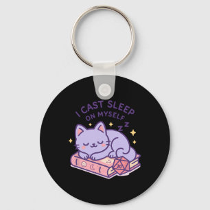 Llavero Gato friki jugador de Rpg durmiendo dados D20 para