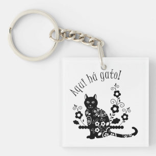 Llavero Gato negro con flores y expresión portuguesa