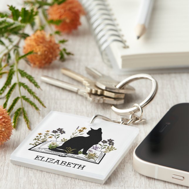 Llavero Gato negro con libro floral (Frente Derecha)