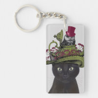 Gato negro con tetera y búho