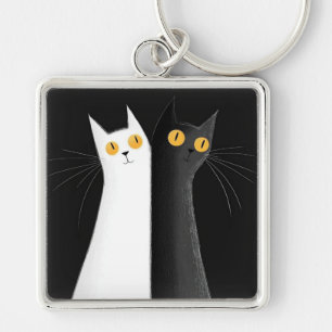 Llavero Gato negro y gatos blancos sobre negro