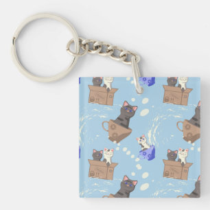 Llavero Gatos en caja y gotas de leche en azul