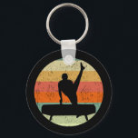 Llavero Gimnasia masculina masculina masculina al atardece<br><div class="desc">Equipo masculino de gimnasia masculina Sunset. Gimnasta masculina fuerte sobre un caballo de pomelo frente a una fresca imagen retro de puesta de sol.</div>