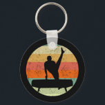 Llavero Gimnasia masculina masculina masculina al atardece<br><div class="desc">Equipo masculino de gimnasia masculina Sunset. Gimnasta masculina fuerte sobre un caballo de pomelo frente a una fresca imagen retro de puesta de sol.</div>