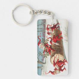 Llavero Gnomes dragging a cut tree trunk through the snow