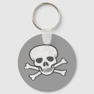 Llavero gris del cráneo y de la bandera pirata