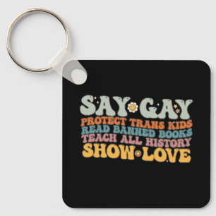 Llavero Groovy LGBT dice Gay Protect Trans Kids Leer libro
