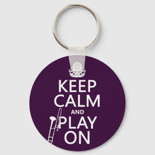 Llavero Guarde la calma y el juego en (Trombone)