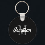 Llavero Guión de pincel retro Monograma blanco gris negro<br><div class="desc">Esta cadena de claves personalizada presenta su nombre en un guión de pincel retro blanco inspirado en vintage sobre su monograma inicial en el tipo de letra serif gris sobre un fondo negro. Un diseño sencillo pero distintivo que hace un gran regalo para un hombre o una mujer.</div>
