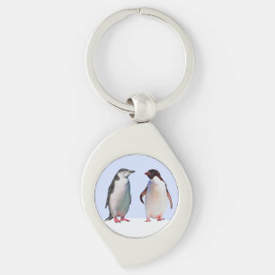 Llavero Hermosa pareja de pájaros pingüinos en azul claro