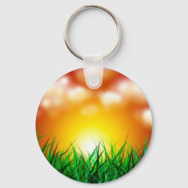 Llavero Hermoso amanecer sobre un campo de hierba