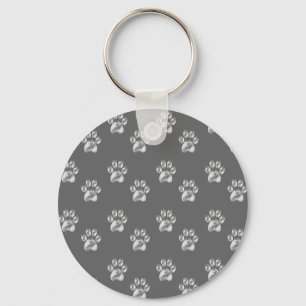 Llavero Hermoso patrón de patas elegante sobre gris oscuro