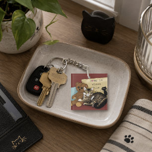 Llavero Hogar Acogedor Burgundy Gato Atigrado Caprichoso