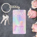 Llavero Holográfico de nombre morado rosa de unicornio<br><div class="desc">Un fondo holográfico de moda con unicornio y colores pastel en rosa,  violeta y verde menta. Decorado con un falso purpurina. Personaliza y agrega tu nombre. Letras de color púrpura. ¡Un poco de luz diaria para alegrar el día!</div>