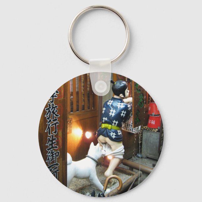 Llavero Humor japonés - Perro sacando pantalones (Anverso)