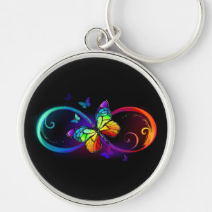 Llavero Infinito vibrante con mariposa arco iris sobre neg
