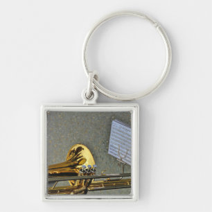 Llavero Instrumento musical del Trombone con la notación