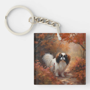 Llavero Japanese Chin en hojas de otoño inspira caída