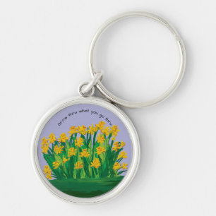 Llavero Key Chain dice, "Crece a través de lo que pasas".