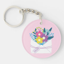 Keychain acrílico con flores sobre fondo rosa