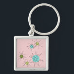 Llavero Keychain de estrenos atómicos rosados<br><div class="desc">Este patrón de Keychain de Starbursts Atómicos Icónicos Rosa presenta estallidos atómicos icónicos. ¡Así es! La vieja escuela, el fondo de color rosa de la primera dama con especkles de oro, es el escenario perfecto para el turquesa vibrante, el apetitoso apio y los círculos kitschy de color verde pera. Las...</div>