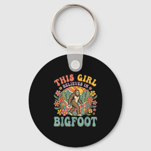 Llavero La chica Bigfoot cree en la puesta de sol floral d