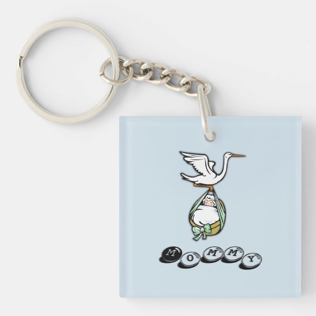 Llavero La cigüeña lleva a un niño bebé (Frente)