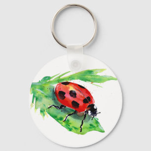 Llavero Ladybug en una hoja verde