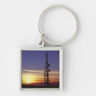 Llavero Las telecomunicaciones mast en la puesta del sol