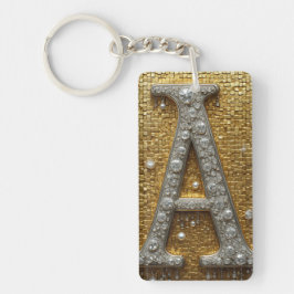 Llavero Letra A con joyas incrustadas sobre fondo de mosai
