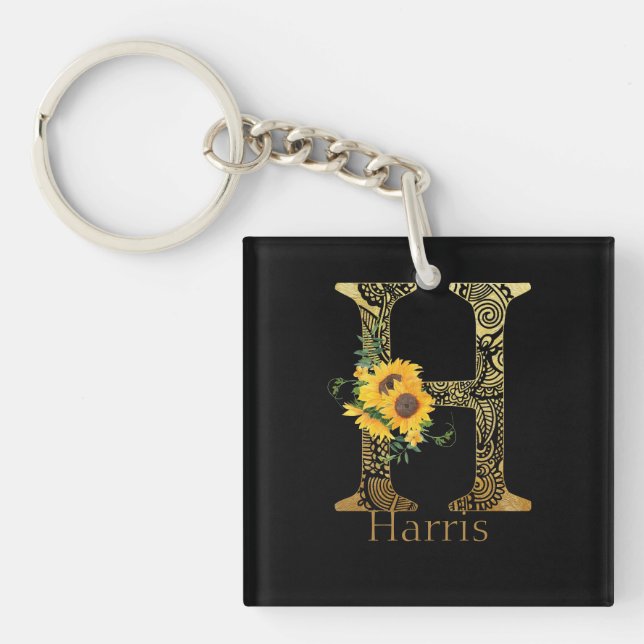 Llavero Letra negra y oro H girasoles (Frente)