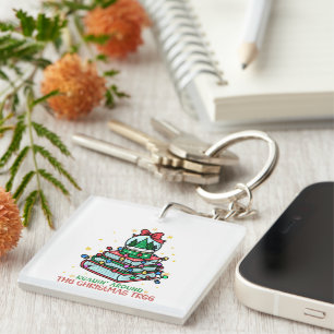 Llavero Leyendo alrededor del árbol de Navidad libresco