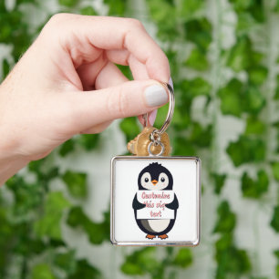 Llavero Lindo pingüino sosteniendo un cartel para texto pe