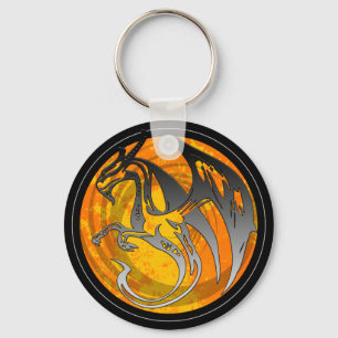 Llavero Llave redonda de ala negra naranja