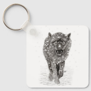 Llavero Lobo negro enojado en la nieve, invierno salvaje