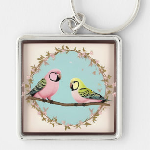 Llavero Loros ilustrativos hermosos juntos en una rama