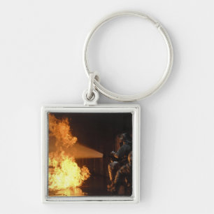 Llavero Los bomberos extinguen un abeto simulado de la