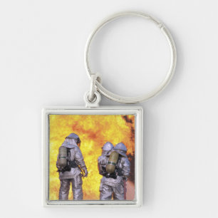 Llavero Los bomberos extinguen un fuego de aviones