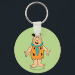 Llavero Los Picapiedra | Fred Flintstone<br><div class="desc">Mira a Fred Flintstone sonriendo con los brazos abiertos.</div>