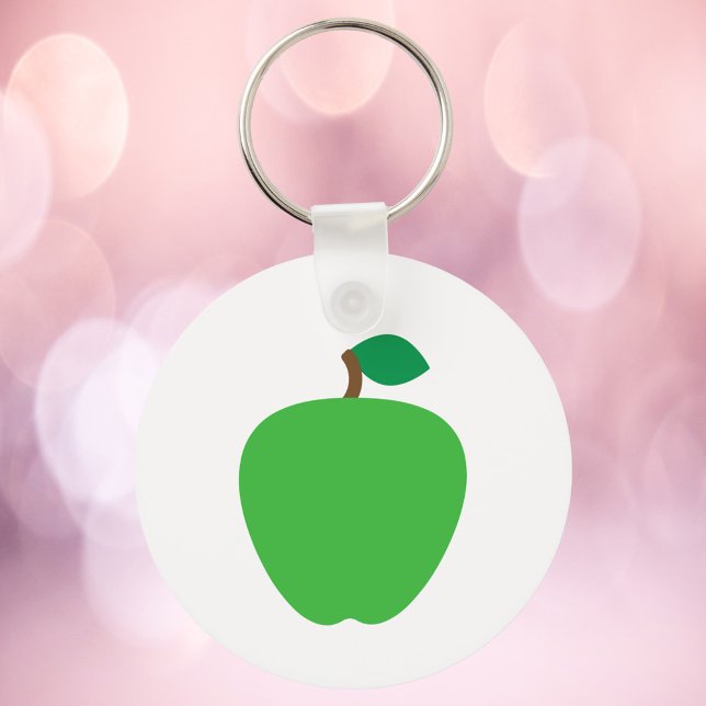 Llavero Manzana verde con hoja (A key chain with a graphic of a green apple)