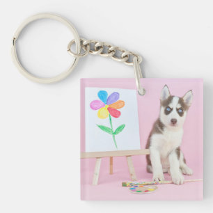 Llavero Marioneta pintando una flor arco iris