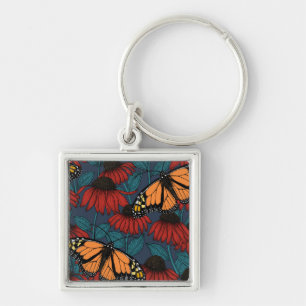 Llavero Mariposa monarca sobre las colmenas rojas