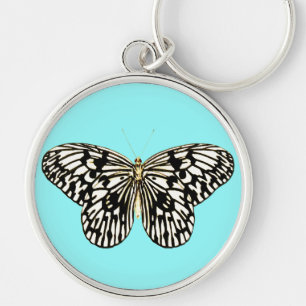 Llavero Mariposa negra y blanca, fondo turquesa