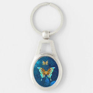 Llavero Mariposas doradas sobre fondo azul