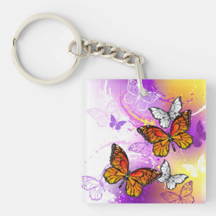 Llavero Mariposas Monarca sobre Fondo Púrpura